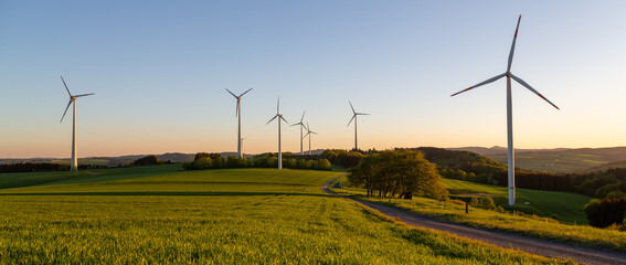 wind turbines on field at dawn - obrazy, fototapety, plakaty