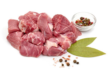 Raw fresh meat chunks, ingredients for goulash, isolated on white background. High resolution image.