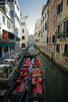Four gondolas on a canal in Venice