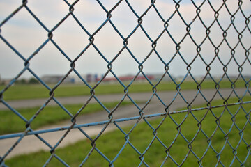 Fototapeta premium fencing of the Chopin airport in Warsaw, fencing mesh