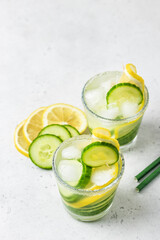 DetoxTropical citrus lemon cucumber summer iced drinks. Space for text.