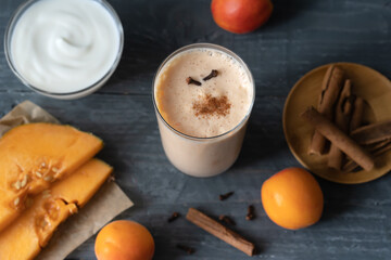 Lassi drink with ingredients on the grey background