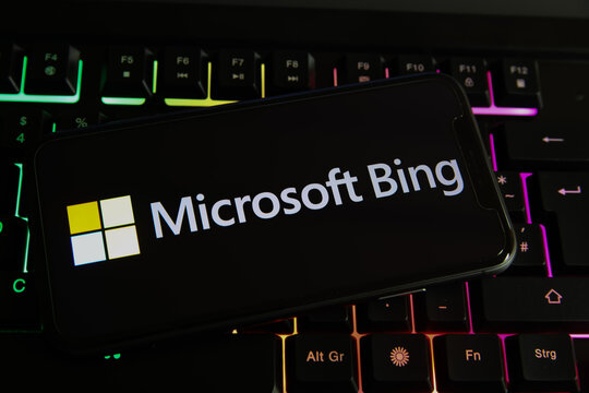 Viersen, Germany - June 1. 2021: Closeup of mobile phone screen with logo lettering of microsoft bing on computer keyboard
