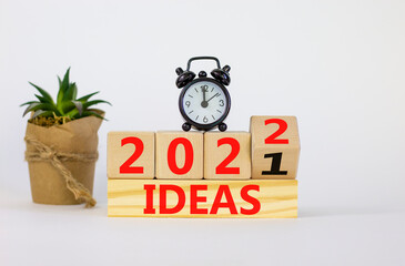 Business concept of planning 2022 ideas symbol. Turned a wooden cube and changed words 'Ideas 2021' to 'Ideas 2022'. Beautiful white background, copy space. Business and ideas 2022 concept.