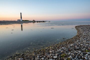 lighthouse in sunset over the sea