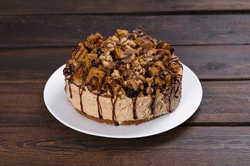 Nut sponge cake with chocolate. Caramel cream