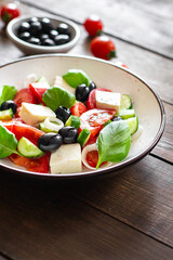 Greek salad feta, olives, vegetables, tomato no meat food organic product meal snack on the table copy space food background rustic. top view keto or paleo diet veggie vegan or vegetarian food
