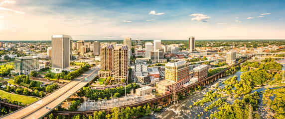 Aerial panorama of Richmond, Virginia, at sunset. Richmond is the capital city of the Commonwealth of Virginia. Manchester Bridge spans James River - obrazy, fototapety, plakaty
