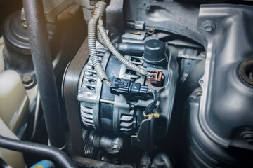 Car alternator in benzine engine, component of the electrical charging system of the car engine,Automotive part concept