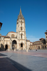 Beautiful view of gothic Cathedral at Oviedo, Asturias. Some unrecognizable people at the square in front of the church. Spain, Europe