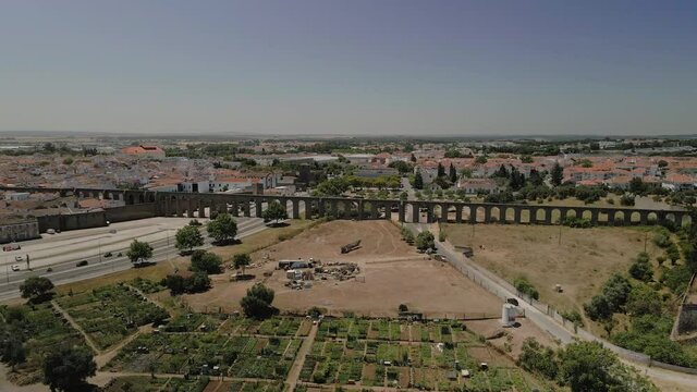 Aerial view of historical Prata Aqueduct in the city of Evora, built between 1531 and 1537, with 9 km leight, its a tourism landmark in Alentejo region. Portugal.