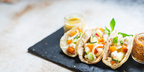 tacos vegetable stuffed flatbread doner kebab pita meal snack on the table copy space food background rustic. top view keto or paleo diet veggie vegan or vegetarian food