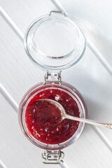 Red rasberries jam in jar.