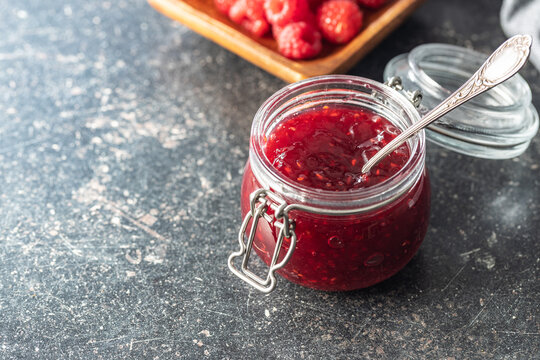 Red rasberries jam in jar.