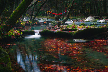 Fall River Scene With Hammock Over Gentle Falls With Colorful Leaves In Fall