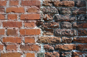 Section of the wall made of old red brick. Background.