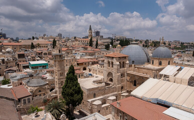 Eye-bird panoramic view on Jerusalem Old City. Two gray domes of Church of the Holy Sepulcher on the foreground. Church of the Holy Sepulcher under reconstruction.
