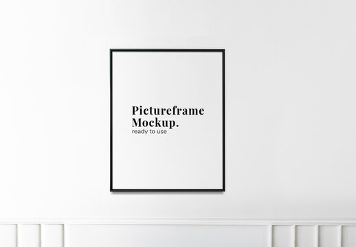 Picture Frame Mockup Hanging on a White Wall