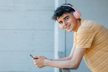 young man with headphones and mobile phone