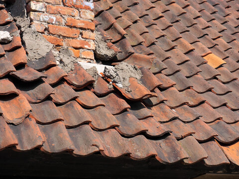 The Tiled Roof Collapses After A Strong Wind.