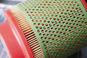 Paper air filter with red rubber. 