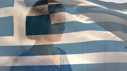 Digital composition of greece flag waving against stressed caucasian woman at hospital - Powered by Adobe
