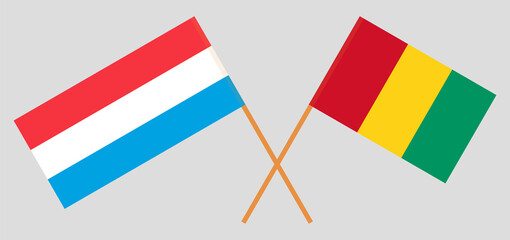 Crossed flags of Luxembourg and Guinea. Official colors. Correct proportion