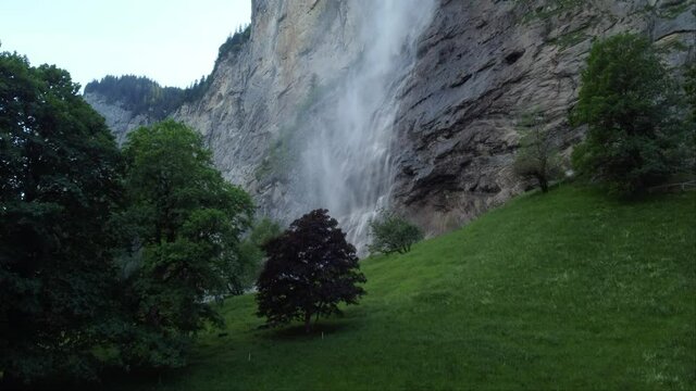 Lauterbrunnen Village with Staubbachfall Waterfall - Jungfrau Region in Summer - Swiss Alps, Switzerland