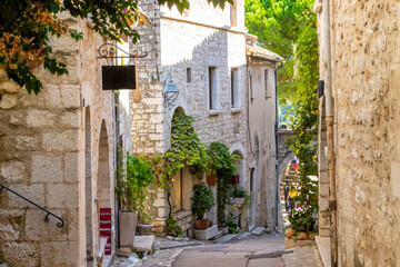 Fototapeta na wymiar Shops and art galleries line the narrow cobblestone roads in the medieval hilltop village of St Paul de Vance on the French Riviera.
