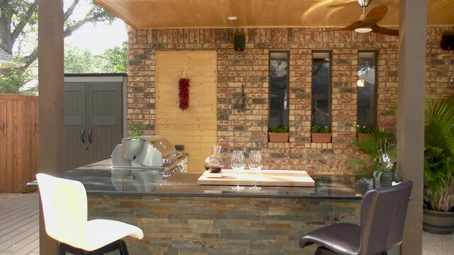 New and modern outdoor kitchen on a sunny summer evening, dinner preparation