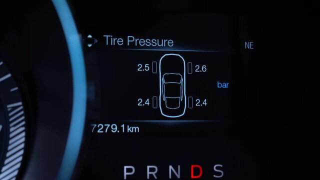 Car display with car resources information. Fuel range, oil life, tire pressure, speed, fuel economy. 4K video footage.