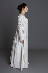 A Regency woman wearing a printed cotton dress