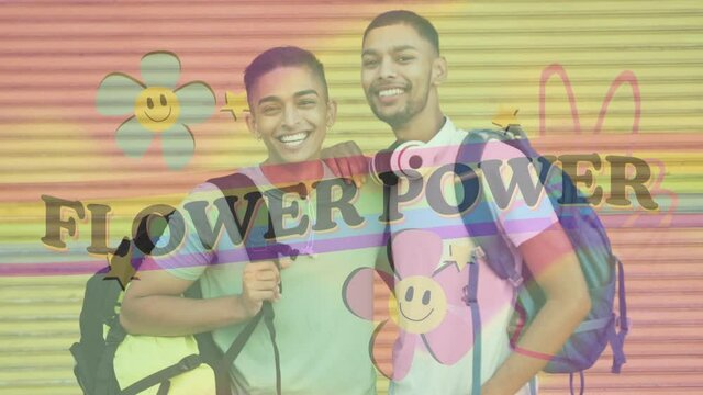 Animation of flower power text with rainbow and flowers over happy male gay couple