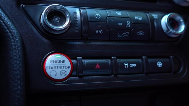 Emergency Car Warning Lights After Breakdown Accident. A mans hand presses the emergency button in the car. 4K video footage.