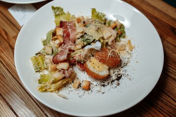 Caesar salad with chicken, cherry tomatoes, lettuce