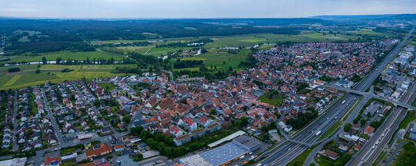 Aerial view of the city Baiersdorf in Germany, on a cloudy morning in spring.