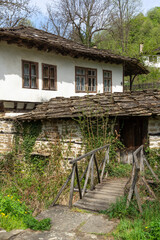 Fototapeta na wymiar Street and old houses at historical village of Bozhentsi, Bulgaria