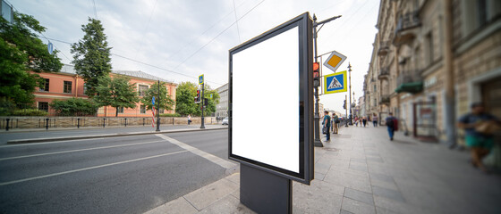 Blank mock up vertical billboard. Street poster on city background