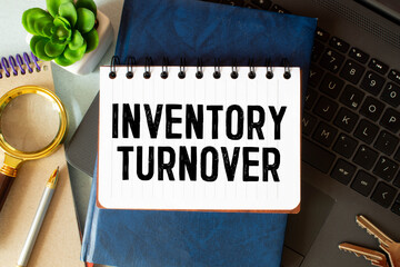 Business Concept, text Inventory Turnover on white paper