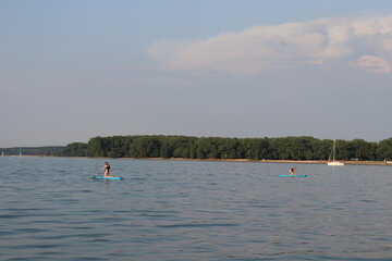 Naklejka premium supboard training lessons at sea 
