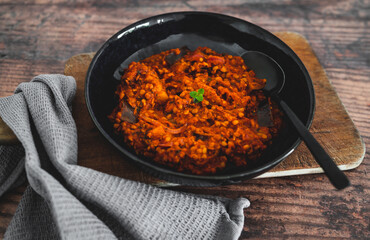 vegan vegan eggplant lentil curry with tomato sauce and cilantro, healthy plant-based food