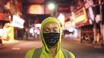Woman close up look caucasian at Pattaya Walking Street with wearing protective medical mask....