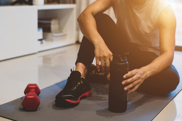 Sport and recreation concept. Young athlete exercise at home breaking rest and stretching after strenuous exercise function training workout with personal trainer and healthy lifestyle.