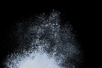 splashing of sea wave crashing on shore spraying white water foam