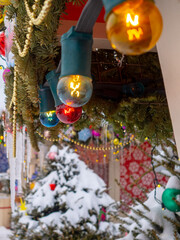 Colorful lamps garlands on the street Christmas decorations on a winter day. Festive decorations for the New Year festival in the city.