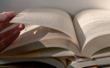 turning pages of a book, reading, library book, education, literacy