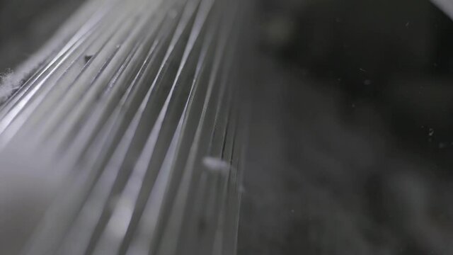 Closeup Shot Of A Spinning Machine Manufacturing Recycled Textiles In A Recycling Plant