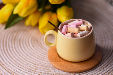 multicolored marshmallows in a coffee cup. a soft dessert for a gourmet. copy space