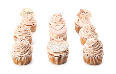 Tasty wedding cupcakes on white background