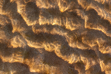 patterns in the water at the beach